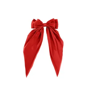 Elegant large red satin bow hair clip with long ribbons for a vintage hair styling