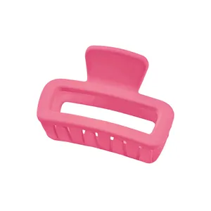Macro detail of a hot pink hollow square hair claw clip with matte resin finish