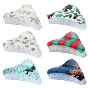 Set of six Christmas themed large triangular hair claws with festive holiday patterns