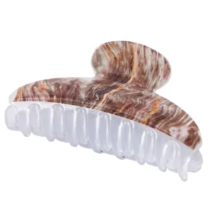 Brown marble pattern large hair claw clip with transparent acrylic teeth on white background