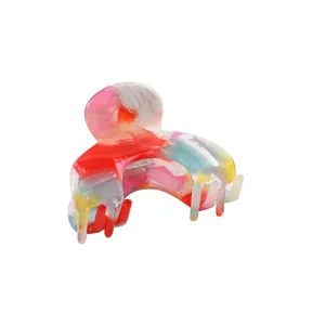 Colorful acetate claw clip with vibrant marble pattern for elegant women hair styling