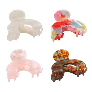 Acetate C-shape hair claw clips set in pearl white, marble pink and tortoiseshell patterns