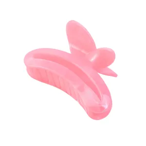 Pink butterfly hair claw clip with marble texture and polished finish for women