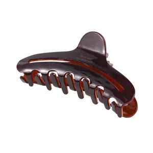Classic dark tortoiseshell acetate claw clip with golden Barrette La France lettering