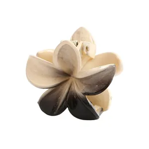 Detailed view of 4cm gradient plumeria flower hair claw clip with durable metal spring