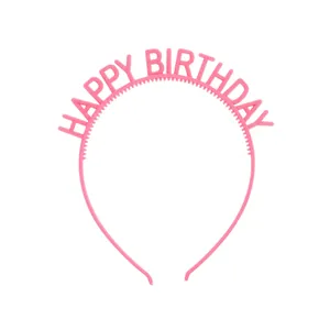 Detail of pink Happy Birthday plastic headband with anti-slip teeth and smooth finish
