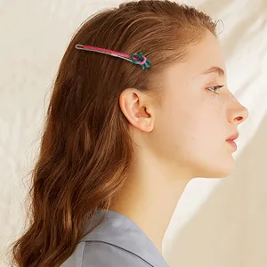 Fashionable bow hairpin with pink and green knots on silver clip for elegant hair styling