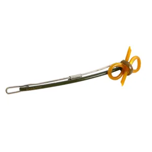 Detail view of a dark green acetate hair clip with a yellow bow and engraved logo