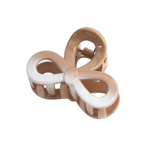 Detail of 4cm butterfly hair claw clip with brown gradient finish and metal spring