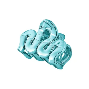 Detailed view of tiffany blue wave-shaped hollow hair claw clip with glossy finish
