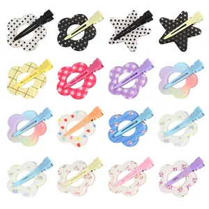 Set de 16 pinzas de pelo de acrílico con forma de flores y estrellas decoradas