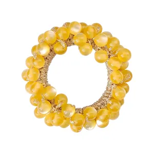 Elegant yellow cat eye stone elastic hair tie with translucent beaded design for women