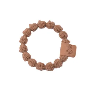 Chouchou en tricot marron avec étiquette lapin en cuir pour queue de cheval mode
