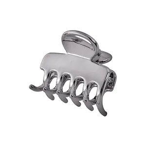 Close-up of polished silver hollow cloud hair claw clip with interlocking teeth