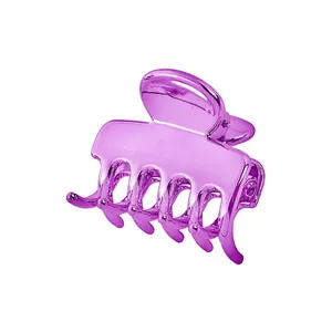 Close-up of a purple metallic cloud-shaped hair claw clip with a hollowed-out design