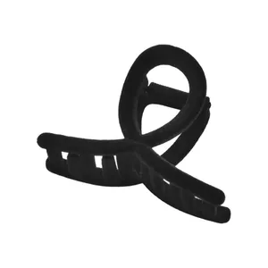 Elegant black flocked hair claw clip with a velvet texture and twist design on white background