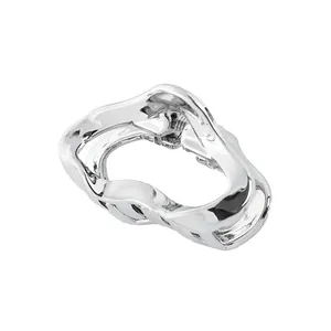 Detailed view of silver liquid metal cloud hair claw clip with sturdy spring mechanism