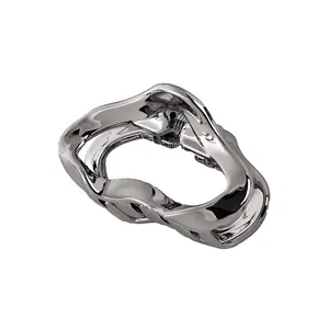 Polished silver liquid metal hair claw clip with irregular wavy design for women