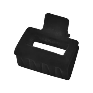 Close-up of black flocked velvet hair claw clip with rectangle hollow design