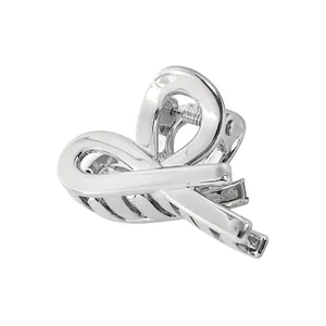 Detailed view of a silver bow-shaped metal hair claw clip with a polished finish