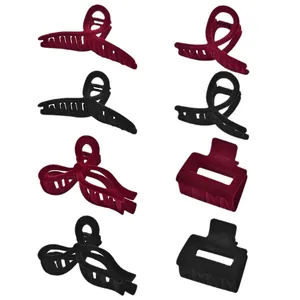 8-piece set of flocked matte claw clips in burgundy and black with various hollow designs