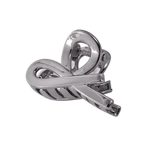 Close-up of elegant silver ribbon-style metal hair claw clip with a high-gloss finish