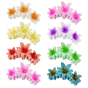 Set of 8 colorful plumeria flower hair claws with triple-layer petal design