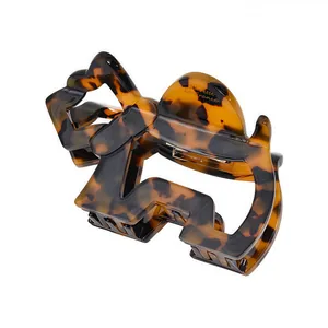 French style tortoise shell acetate hair claw clip with elegant twisted bow design