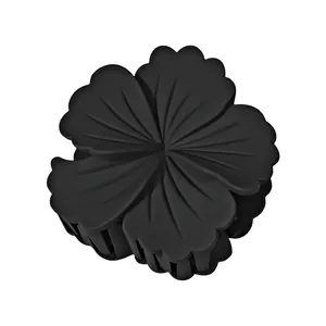 Detailed view of large matte black flower hair claw clip with sturdy spring mechanism