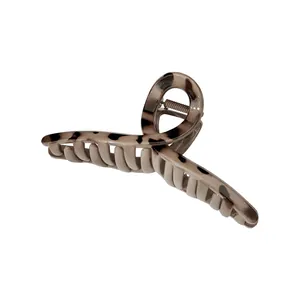 Classic tortoiseshell hair claw clip with vintage leopard print and metal spring mechanism