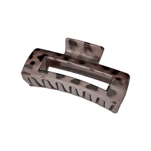 Detail of rectangular claw clip with grey and brown marble tortoiseshell pattern