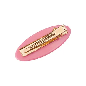 Rosa ovale Haarspange aus Acetat mit goldenem Entenschnabelclip in der Rückansicht