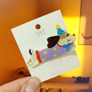 Cute spotted puppy acrylic hair clip with star pattern outfit on white display card