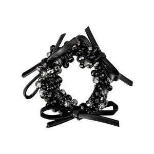 Beaded hair tie with black faux leather bows and faceted grey crystal beads
