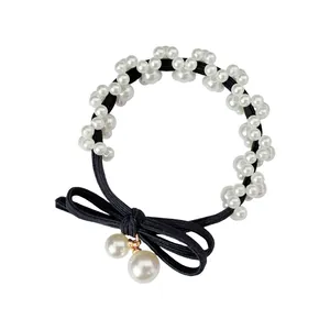 Elegant pearl bow hair tie with black elastic band and hanging faux pearls for women