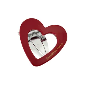Red heart-shaped hollow acetate hair claw with Barrette La France gold lettering for women