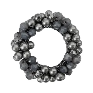 Detail of dark grey beaded elastic hair tie with polished pearls and faceted crystals