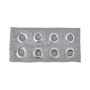 Detail of grey ribbed fabric headband featuring eight silver metallic eyelets for punk style