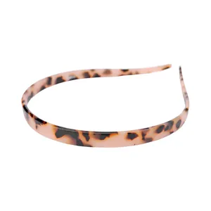 Minimalist tortoiseshell hair hoop in light pink resin with brown leopard pattern