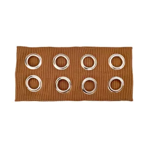 Detail of caramel brown ribbed knit headband with eight silver metal eyelet grommets