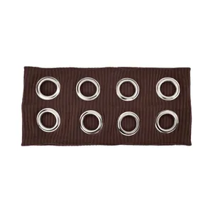Detail of dark brown ribbed knit headband with eight large silver metal grommets decoration