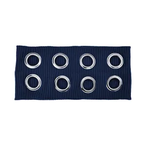 Detail of ribbed navy blue headband featuring eight silver metallic eyelets in two rows