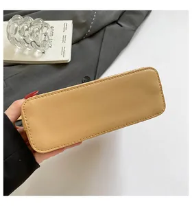 Detailed macro view of the reinforced rectangular bag bottom with neat stitching