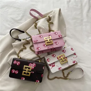Fashionable cherry print square crossbody bags in pink white and brown with gold chain strap