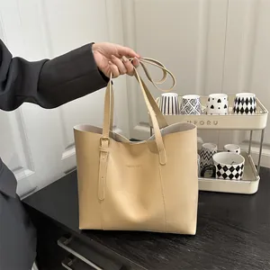 Minimalist beige leather tote bag with Fashion & Bags text for daily commuting and work
