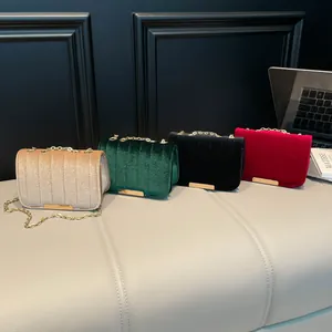 Quilted velvet chain bags in champagne green black and red with gold metal trim