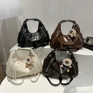 Versatile soft leather tote backpack in black, brown, cream with plush sheep charm