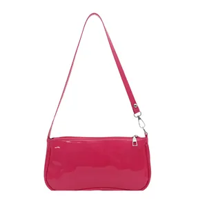 Fuchsia patent leather baguette shoulder bag with shiny finish and silver hardware