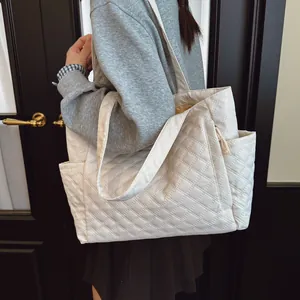 Chic white quilted nylon tote bag with rhombus pattern for elegant autumn fashion styles
