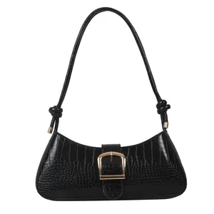 Chic black crocodile embossed baguette underarm bag with gold buckle and knot strap detail